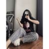 Ảnh của Set bộ áo cô gái tai nghe mix quần kẻ